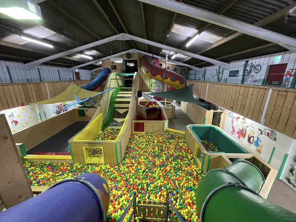 Indoor soft play area with ball pits and slides