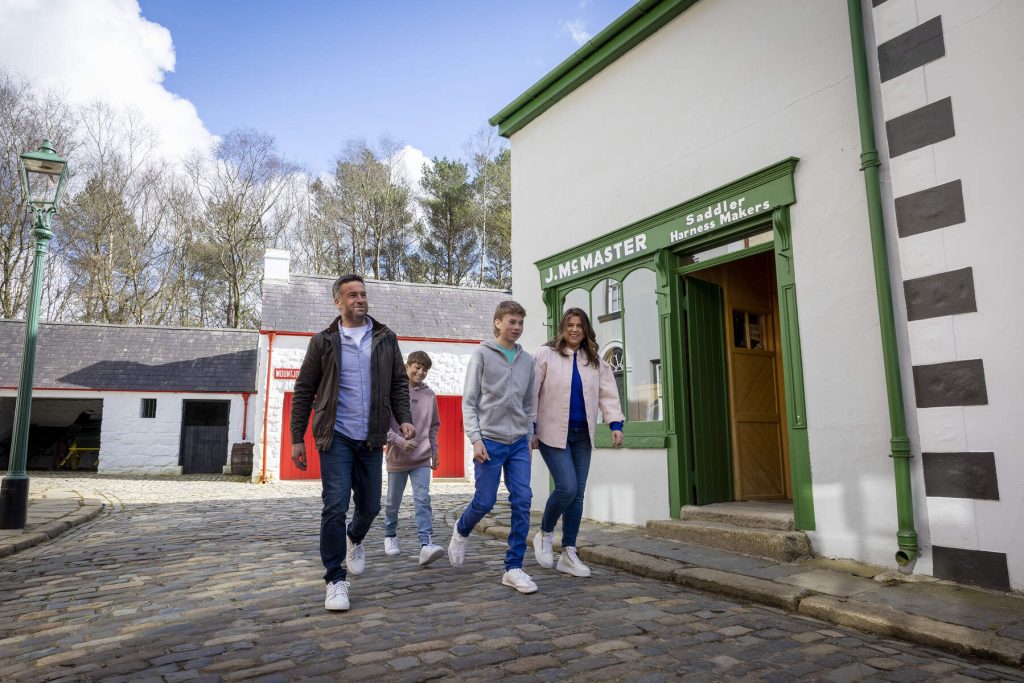 Family walk through street at Ulster American Folk Park