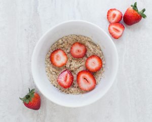 Baked oats for breakfast topped Wirth strawberries