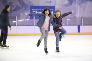 two girls ice skating