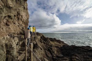 People walking along the cliff face at The Hobbins Cliff Path