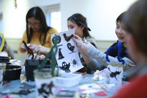 Children doing Halloween crafts